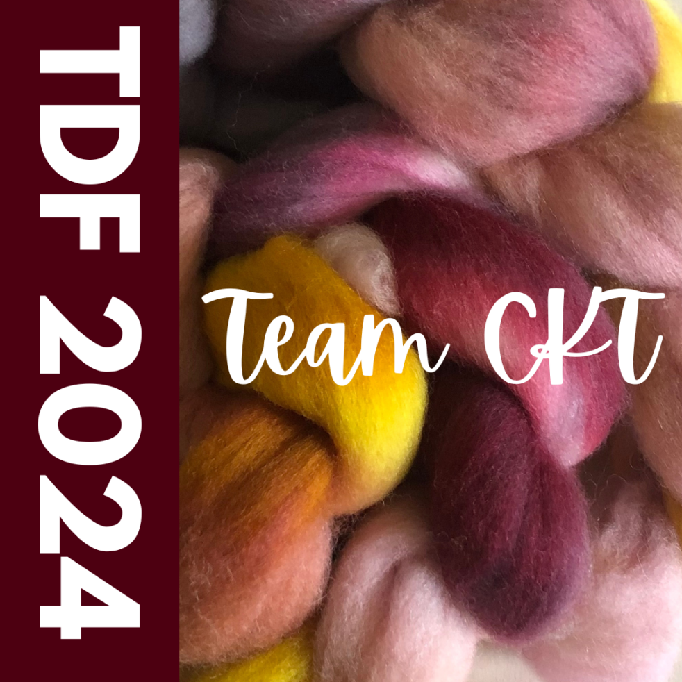 A bump of fiber in reds, pinks, and yellows. Text read TEAM CKT 2024.